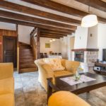 Living room in Villa Maruka with TV and fireplace